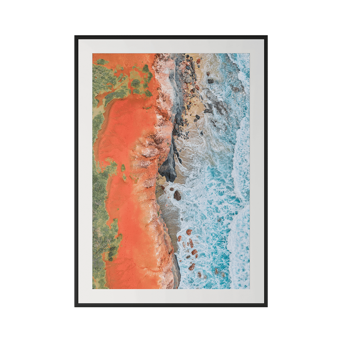 THE SEAM is a framed aerial photo with museum-grade framing, featuring bright orange-red land meeting a rocky coastline and vibrant blue sea. Its striking earth-meets-water contrast makes it perfect for luxury coastal décor. - The Coastal Edit Australia